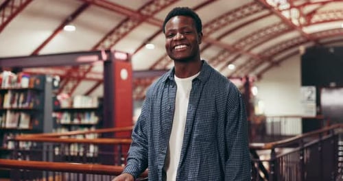 Face, student and black man in library, smile and education with knowledge, scholarship and college