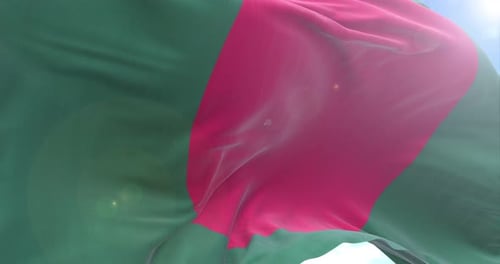 Waving Bangladesh National Flag in Wind with Sunlight