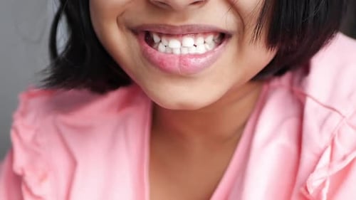 Portrait of Child Showing Her Teeth