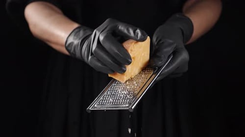 Italian French Cuisine Cheese Being Grated Shot on Black Background Restaurant Food Cooking and
