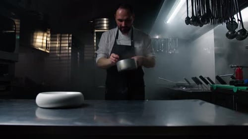 Chef Working In A Restaurant Kitchen For Dinner