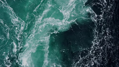 Waves of Water of the River and the Sea Meet Each Other During High Tide and Low Tide