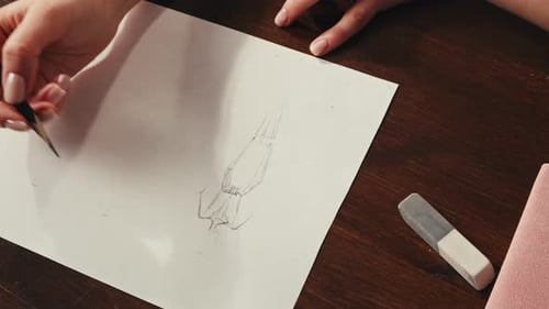 Young Woman Designer is Drawing Some Clothes By Pencil Using Ruler on White Paper The Costume