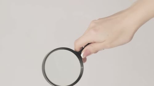 Vertical Zooming Glass Exploring Lens Woman Hand