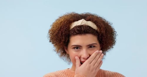Model, studio, portrait and happy with comic face or emoji, blue background and funny with gesture