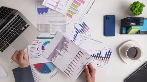 Colleagues Reviewing Business Reports in Office Setting