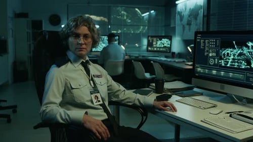Portrait of Female Intelligence Officer at Desk in Military Operations Center