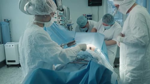 Surgeons Performing Operation in Hospital Operating Room