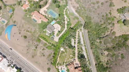Aerial Paraglider Flying Along Blue Ocean Coast Drone View Above Paraglide Wing