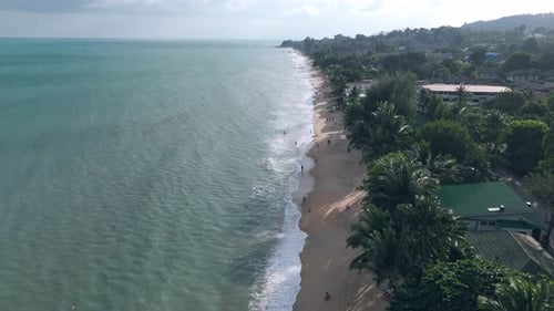Waves of Sea Wash Sandy Shore Aerial View Lively Busy Beach Coast Shore Tourists and Travelers Relax