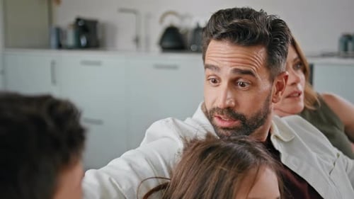 Family Watching Something Together in their Living Room