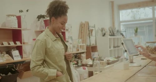 Afro American Woman Paying in Store, Contactless Payment with Credit Card