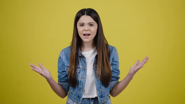Indignant Teen Girl Raising Hands in Shock Shouting Why How What Do you ...