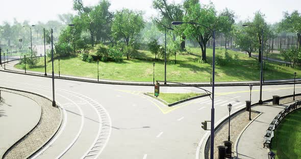 Traffic Intersection Surrounded By Greenery During Daylight in a City ...