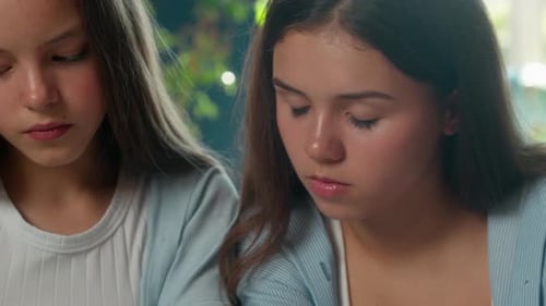 Smart Four Caucasian Teenagers Students Studying Together Writing Homework in Classroom Classmates