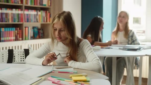 Unhappy Caucasian Little Girl Child Showing Thumb Down Studying Inside Classroom Dislike Gesture Kid