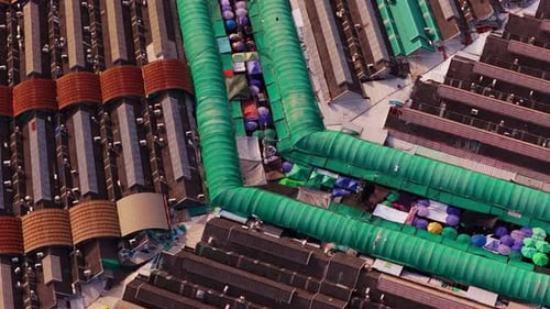 Top Down Aerial View of Crowded Chatuchak Weekend Market in Bangkok Colorful Umbrellas and Green