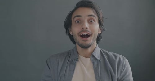 Surprised Man Opens Mouth and Grins