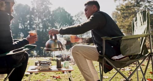 Friends Camping, Enjoying Hot Drinks in Nature
