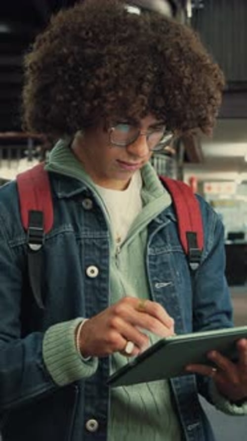 Man, student or thinking with tablet in library for university assignment, knowledge or research