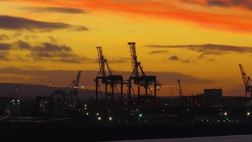 cinematic drone footage of Dublin, Ireland during an unforgettable sunset, showcasing dramatic