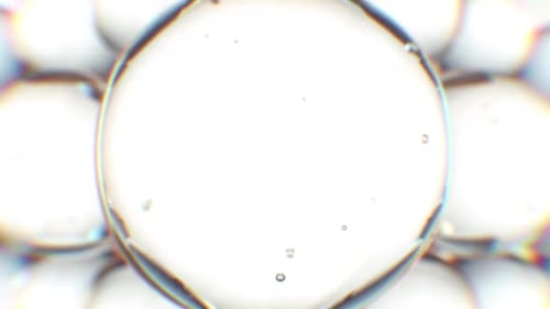 Macro View of Transparent Bubbles and Liquid Spheres with Refractions