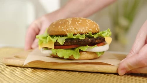 Vegetarian burger in vegan fast food restaurant. Serving tasty sandwich in burger joint