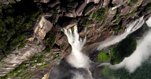 Breathtaking Aerial View of Massive Waterfalls Plunging Into Deep Canyons