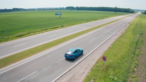Beautiful audi car on empty highway. Blue electric automobile moving on a road.