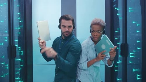 Two Dedicated Professionals are Actively Collaborating in a Modern Hightech Workspace Environment