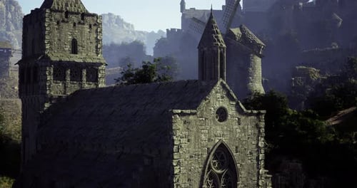 Historic Architecture in a Serene Landscape with Windmills and Mountains
