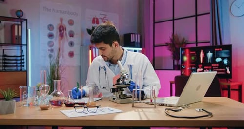 Researcher Using Microscope in Science Lab