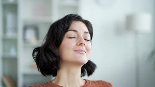 Attractive Woman Smiling and Relaxing Inside