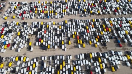 a lot of cars parked in a automotive factory