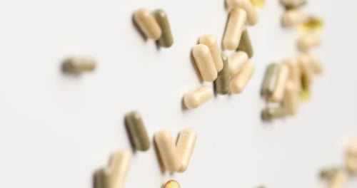 Pharmaceutical Capsules Filling Frame on White Surface