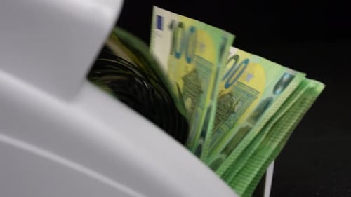 Euro Banknotes Being Counted By Machine