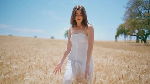 Relaxed Woman Strolling Sunlight Farmland Serene Lady Touching Wheat at Harvest