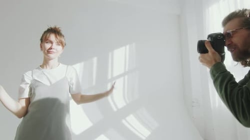 Fashion Model Posing for Photographer in Studio