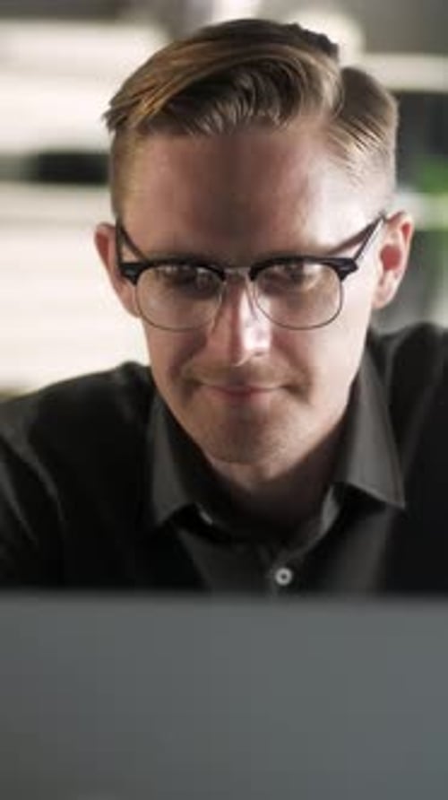 Young Man Freelancer Using Laptop Online Working From Office In Internet Smiling Focused Millennial