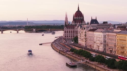 Aerial Shot of Danube River Waterfront in City Historic Buildings and Hungarian Parliament at