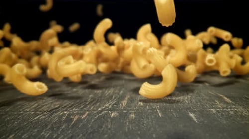 Dry Pasta Falls on the Table Filmed on a Highspeed Camera at 1000 Fps