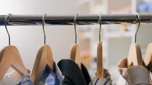 Retail, Shopper Relaxed Selecting Clothes From Huge Variety Warehouse Of Clothing Shirts Camera