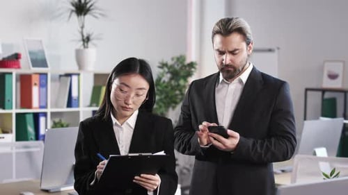 Business Colleagues Working Together in Office Space