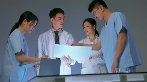 Medical Team Collaborating on Research in Lab