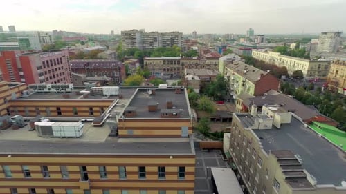 Flying Over City Roofs