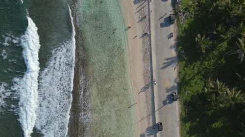 Aerial View Ocean Waves and Road Next to Caribbean Beach. From Above. San Andres Island, Colombia