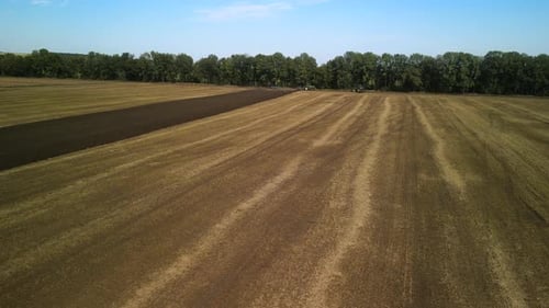 Tractors plowing the field in Ukraine