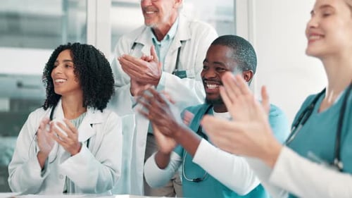 Applause, teamwork and doctors in hospital to celebrate success, collaboration and winning