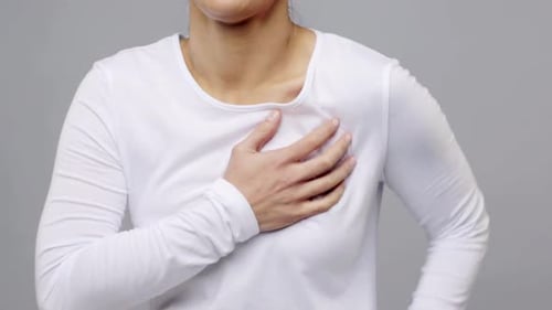 People, Healthcare and Problem Concept - Woman Suffering From Heart Ache Over