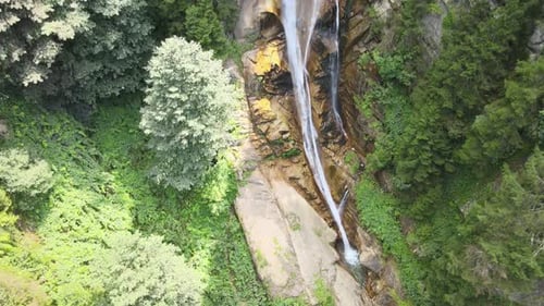 Aerial View of Waterfall in Green Forest